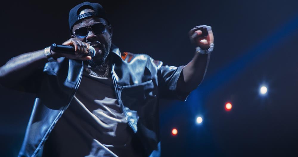 A hip-hop artist performing on stage